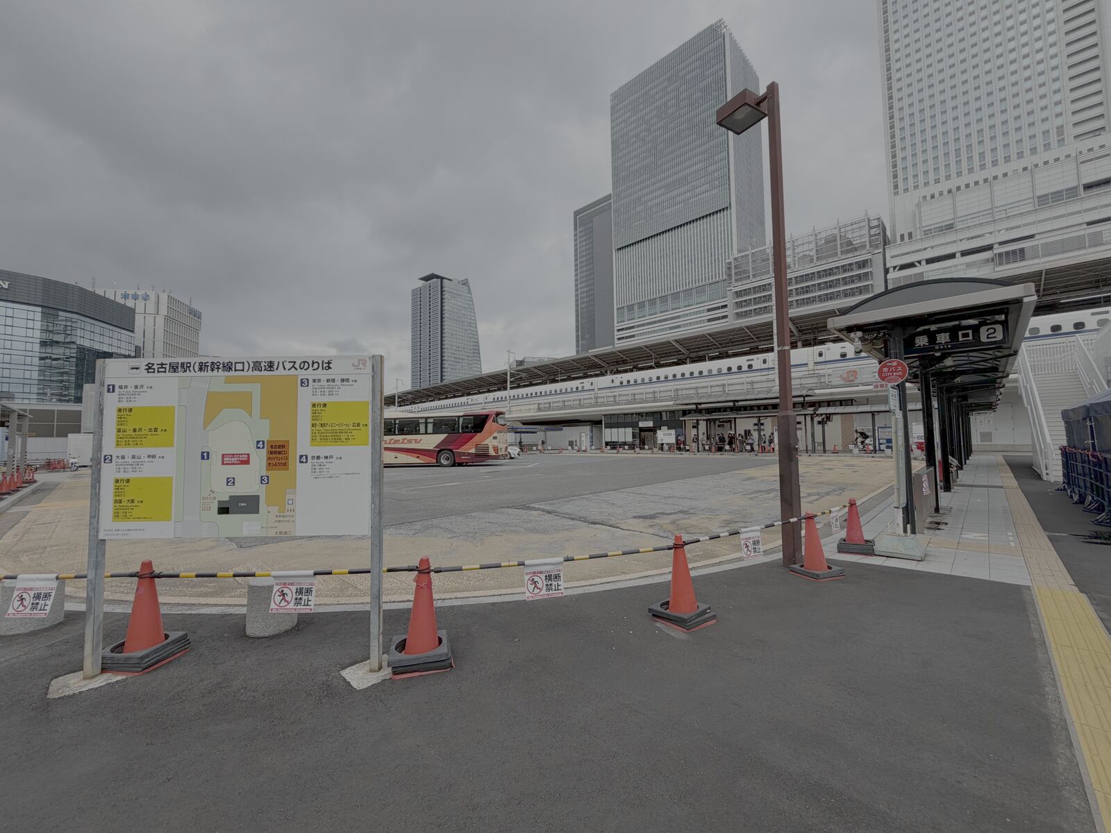 JR Highway Bus boarding area at Nagoya Station's Shinkansen side, with a route board and waiting bays.